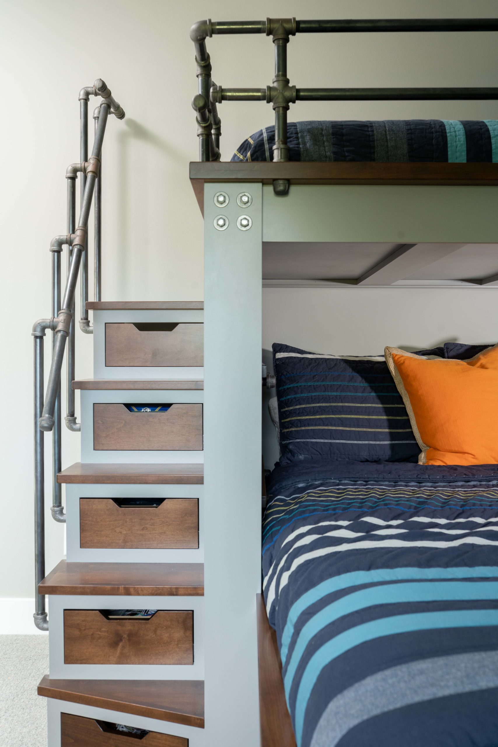 A bunk bed with stairs and drawers from Kitchens portfolio.