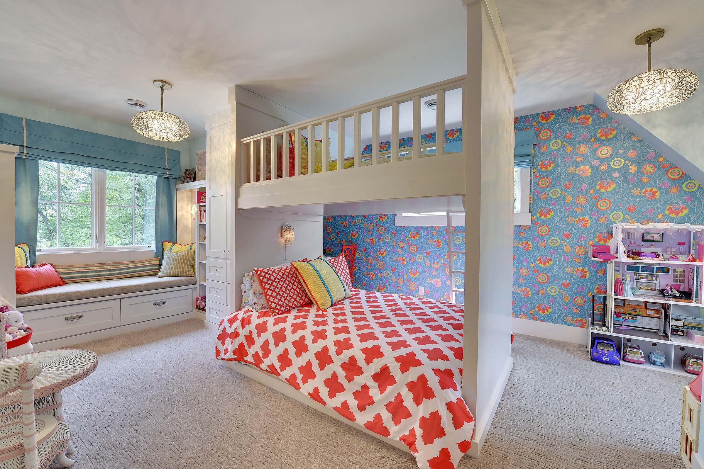 A children's bedroom with a bunk bed, a desk.