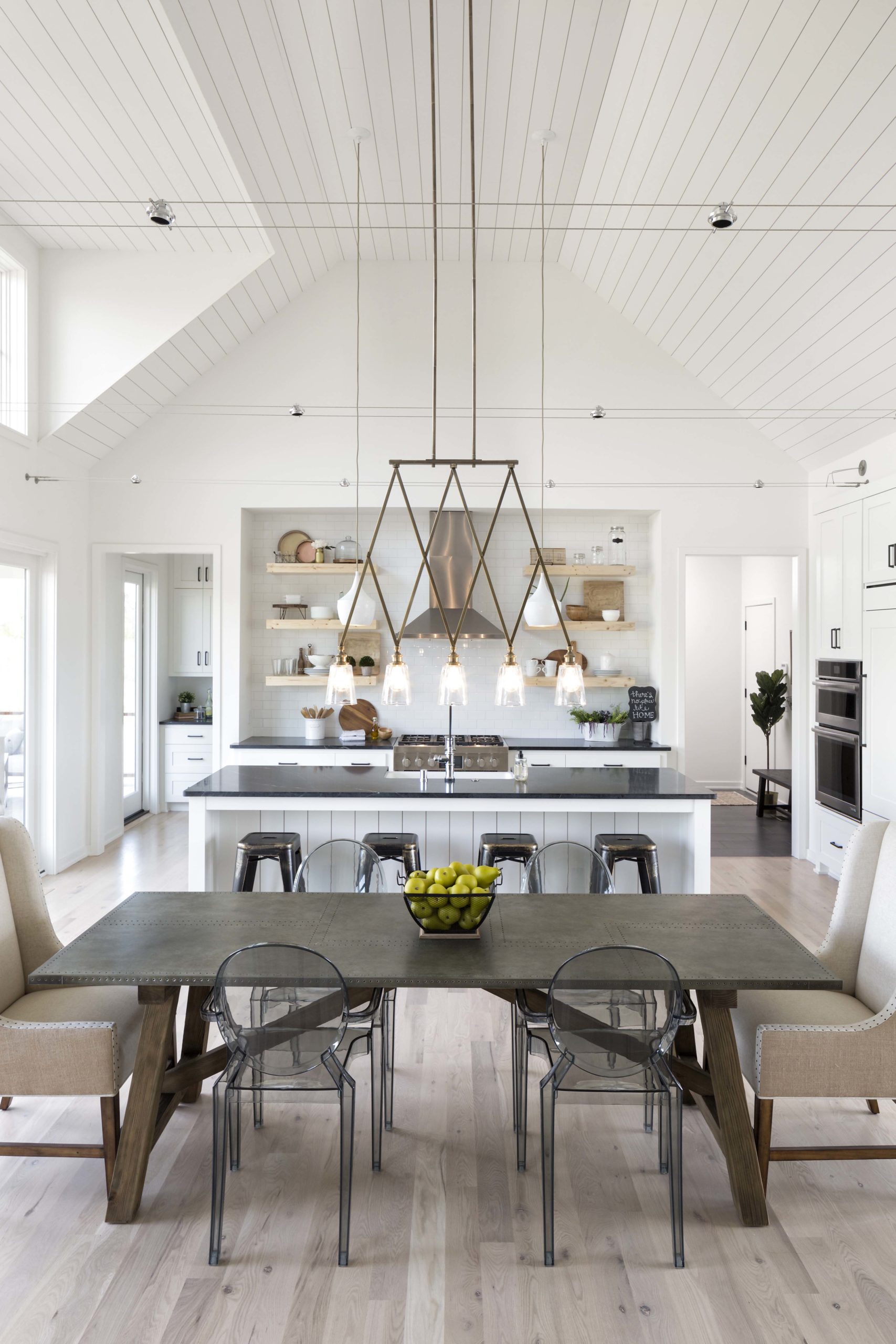 farmhouse style dining room with vaulted shiplap ceiling