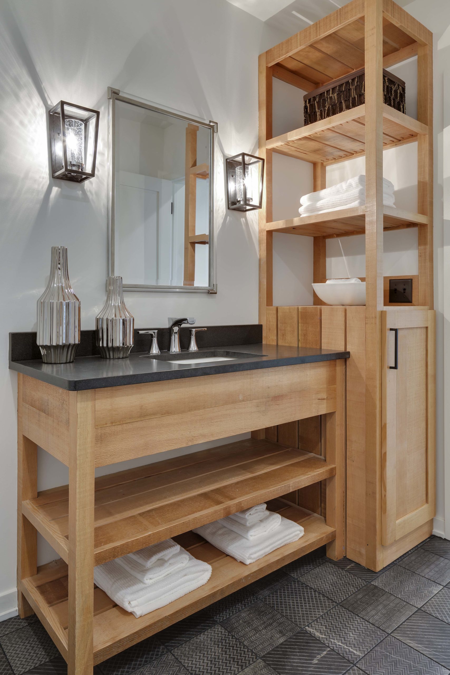 wood bathroom vanity with open wood shelving to hold towels