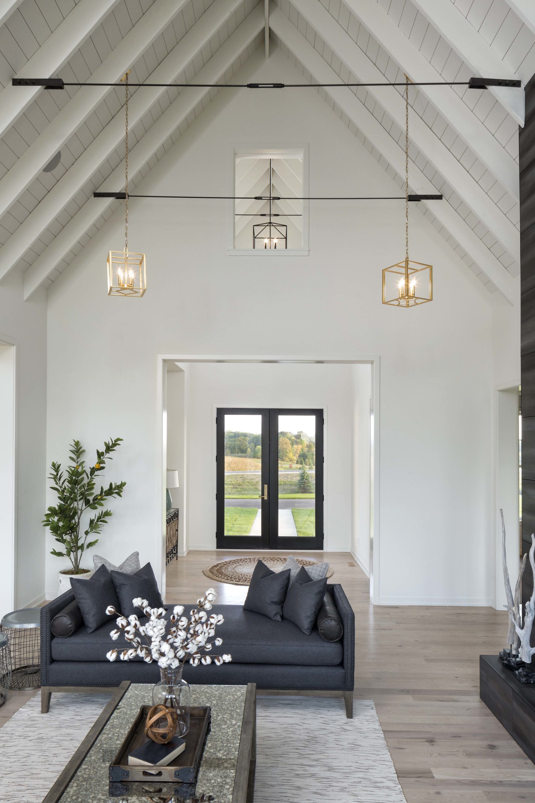 A modern living room with a vaulted ceiling in a farmhouse-style home in Lakeville, Minnesota.