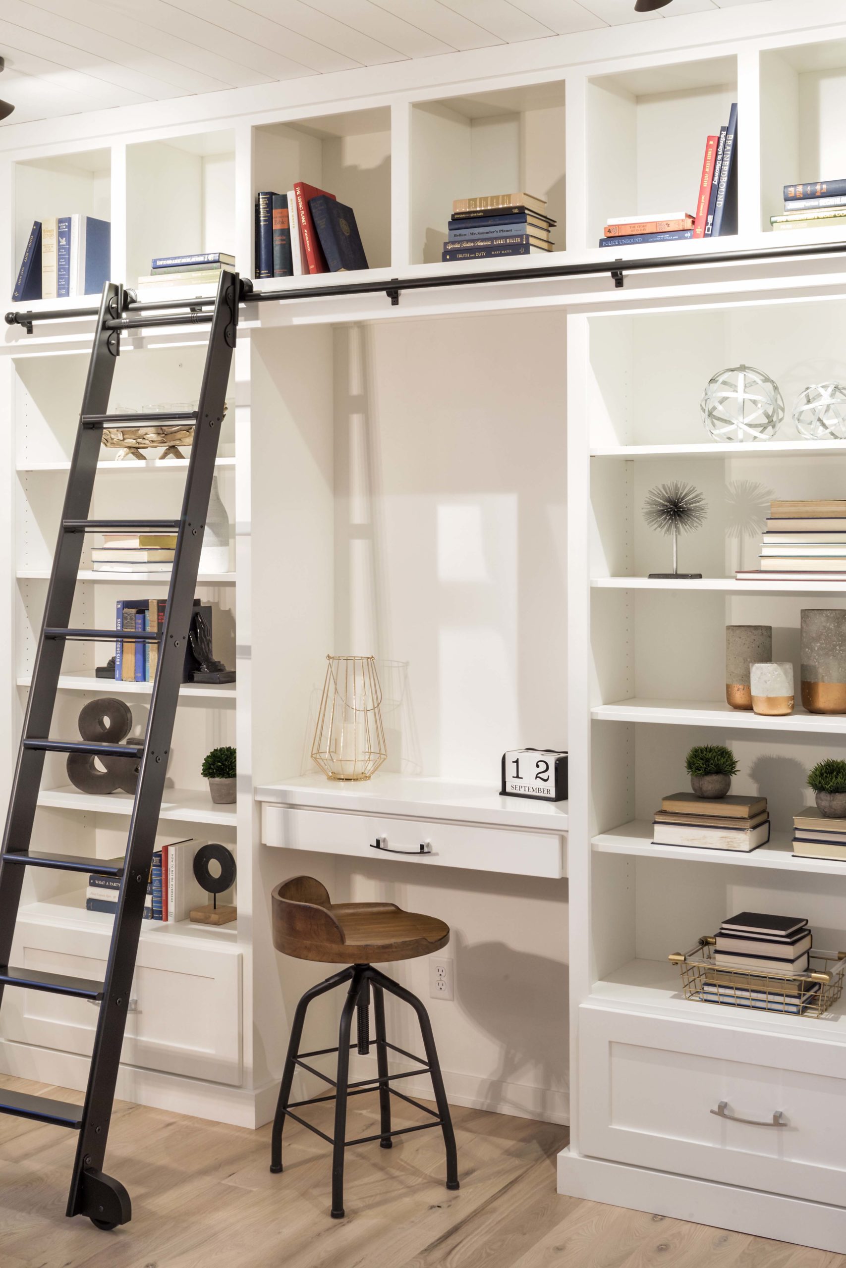 A farmhouse home office in Lakeville, Minnesota with a ladder and bookshelves.