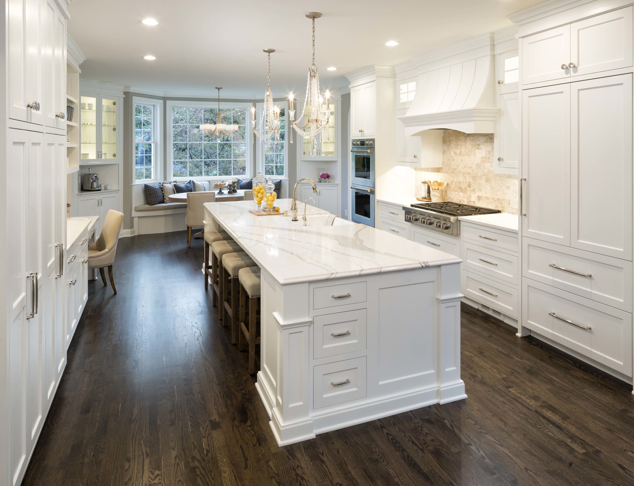 traditional kitchen with white cabinets and an oversized center island