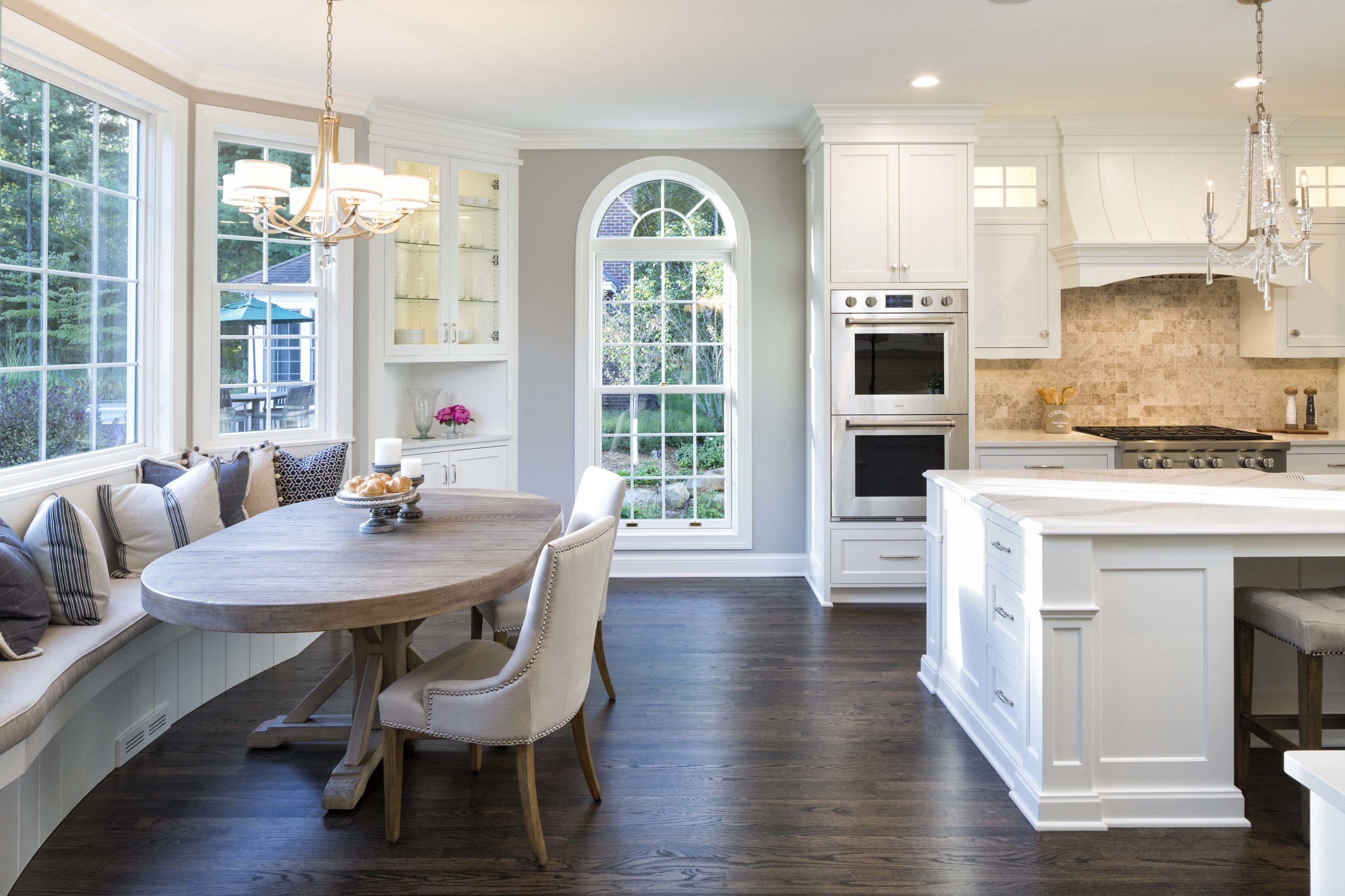 breakfast nook and traditional white kitchen