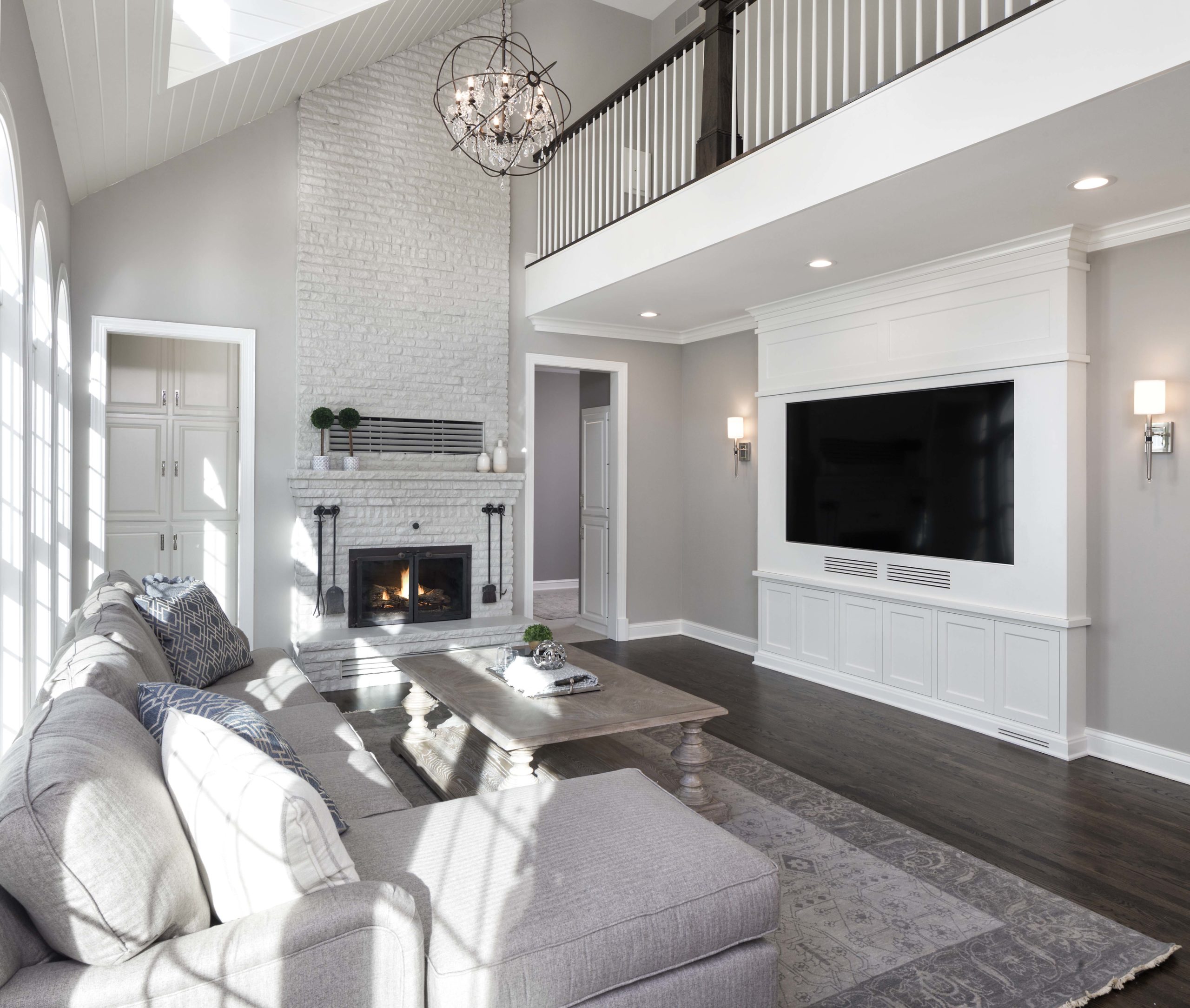 white living room with two story ceilings