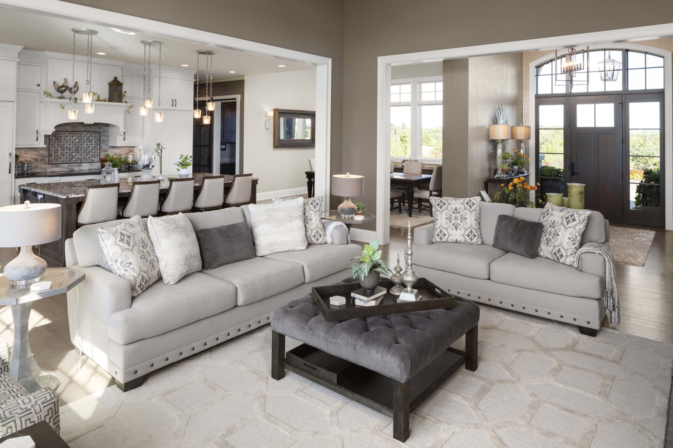 living room with two gray sofas and a square grey coffee table in the middle