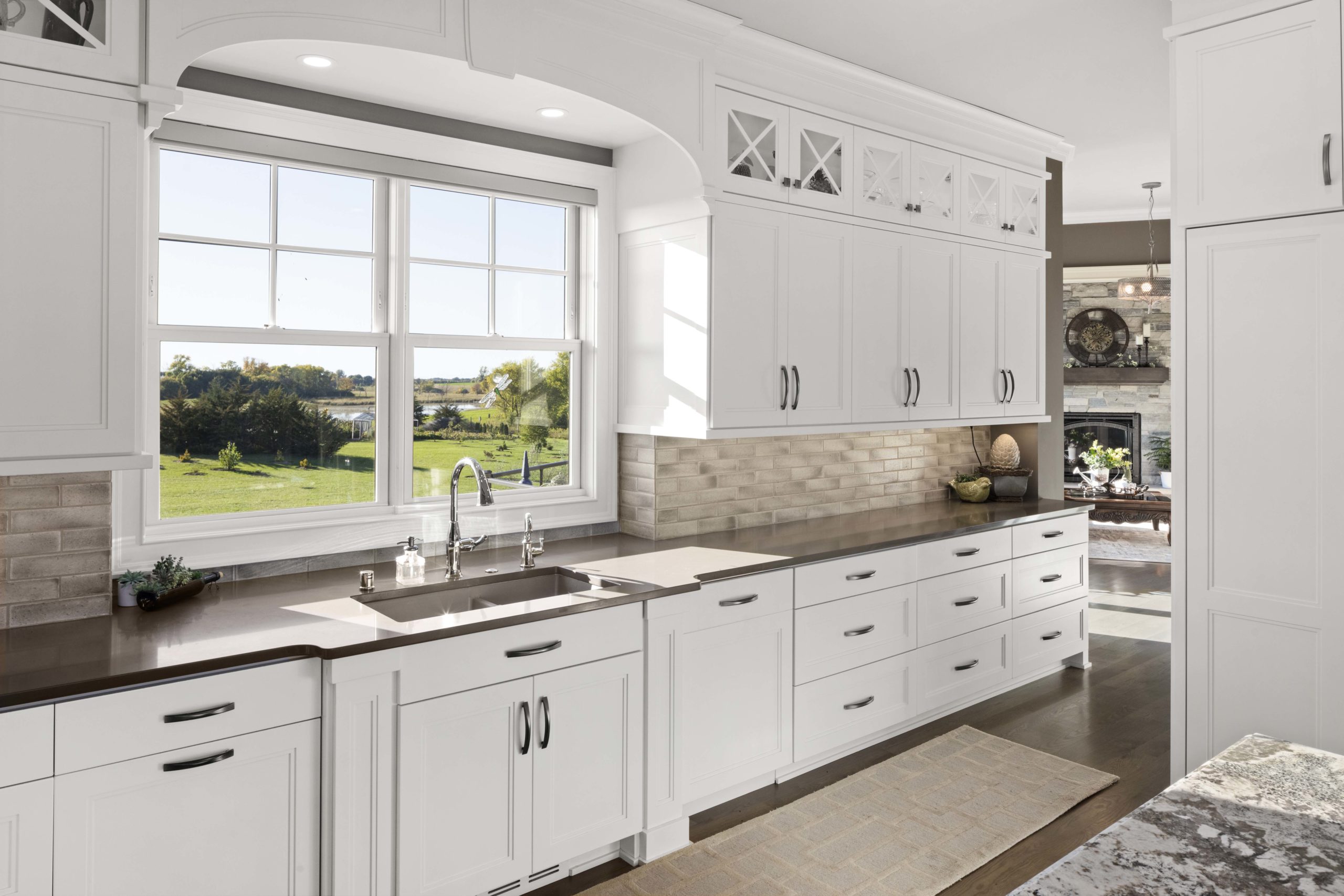 Kitchen with white cabinets and brown counterops