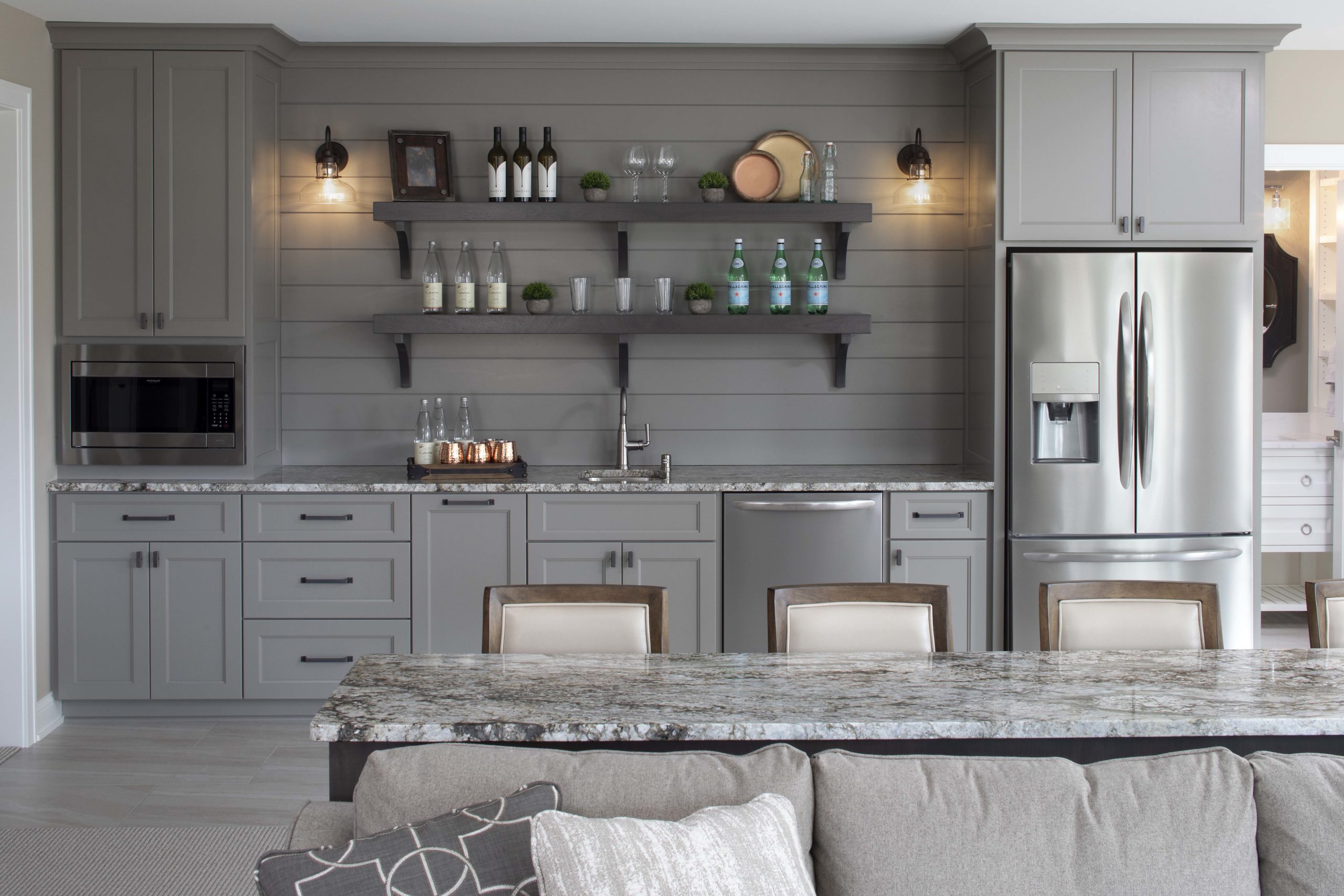 monochromatic grey wet bar with grey cabinets and shiplap
