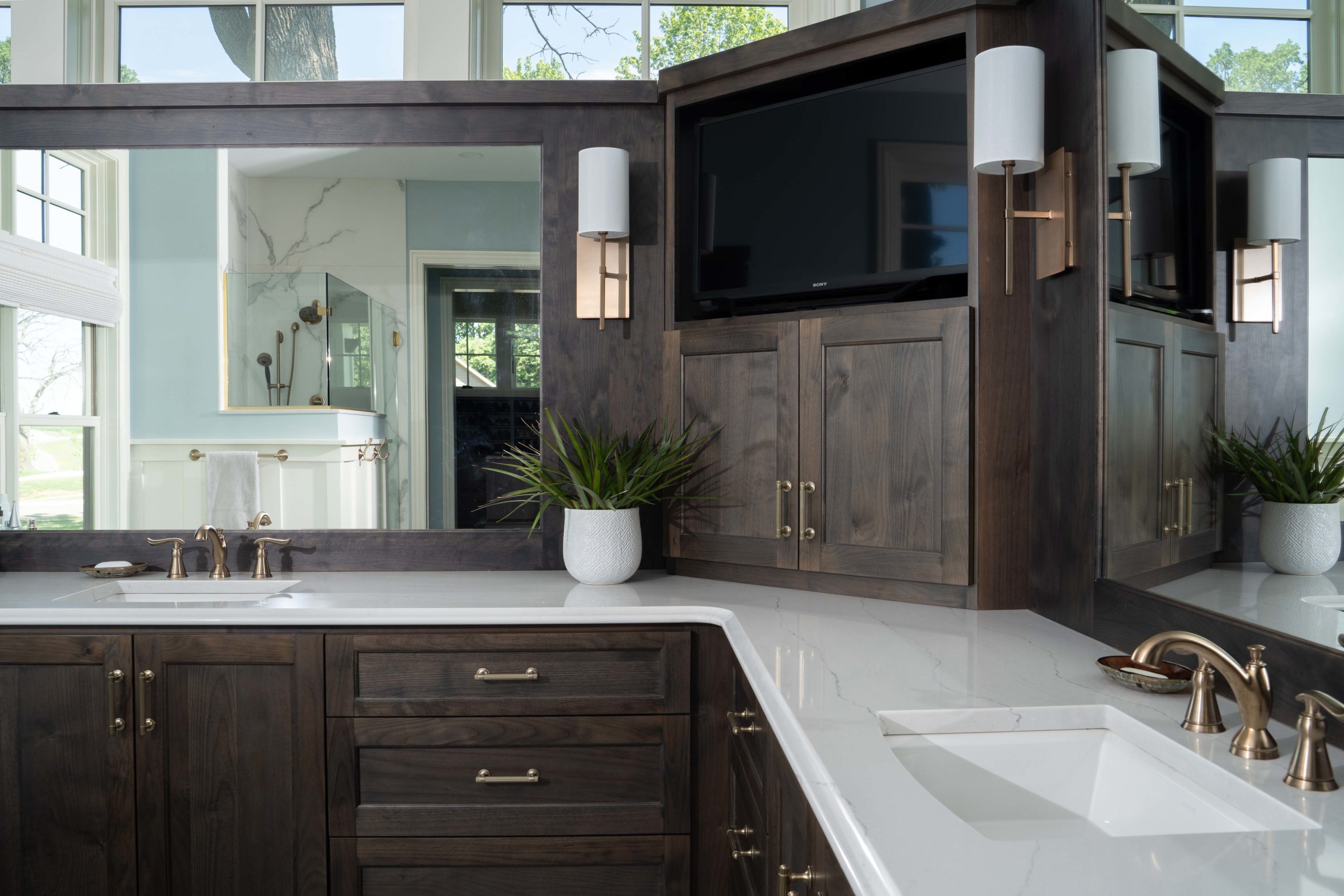 White Oak Lane: A bathroom with two sinks and a TV.