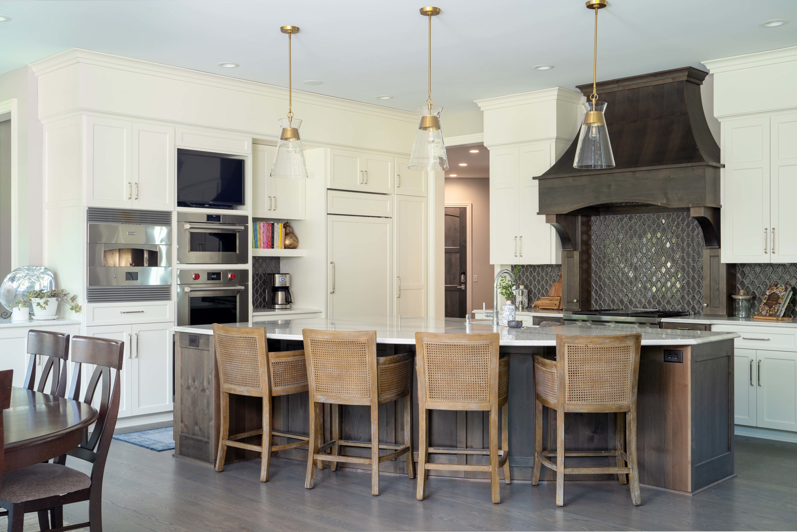 A large kitchen with a center island and bar stools on White Oak Lane.