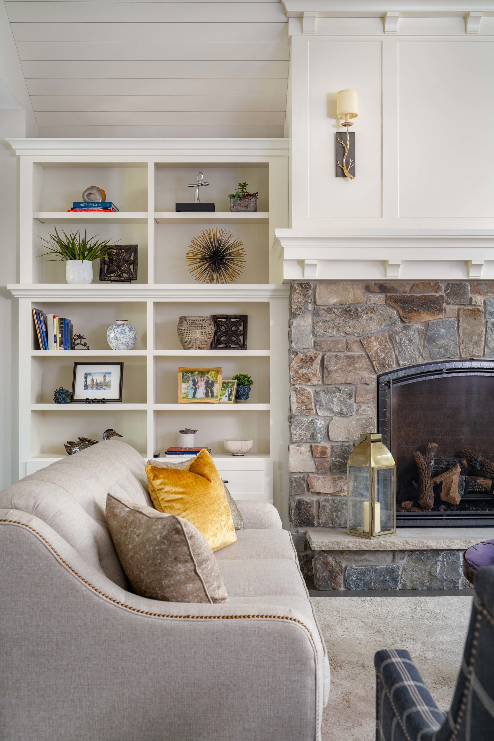A cozy living room on White Oak Lane, complete with a fireplace and bookshelves.