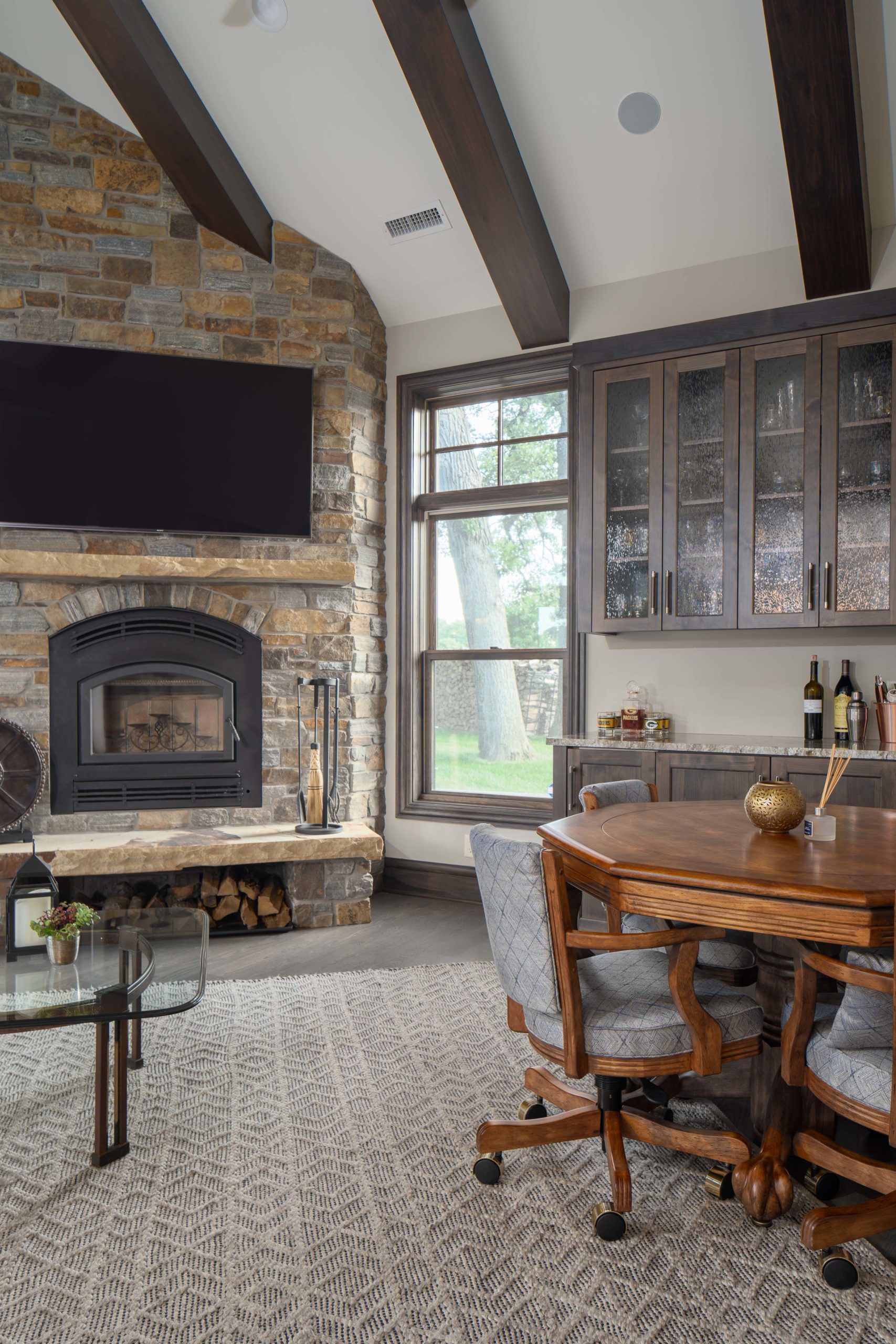 A stone fireplace in a living room on White Oak Lane.