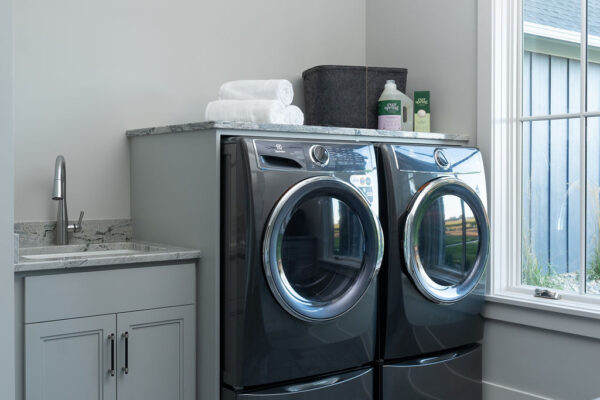 A woodside road laundry room remodel with a washer and dryer in Minnetonka.