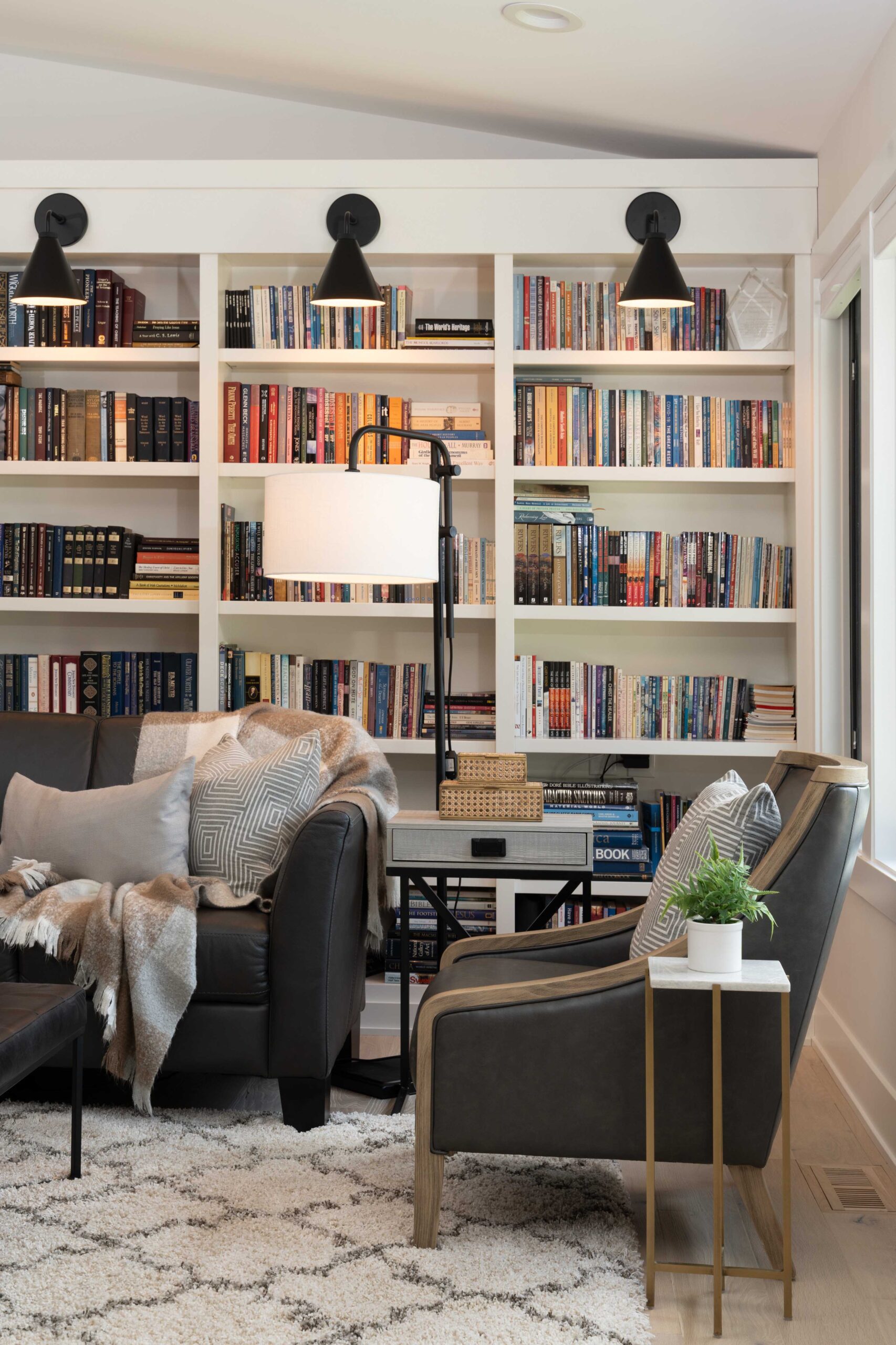A living room with bookshelves in an Orchard Lake remodel.