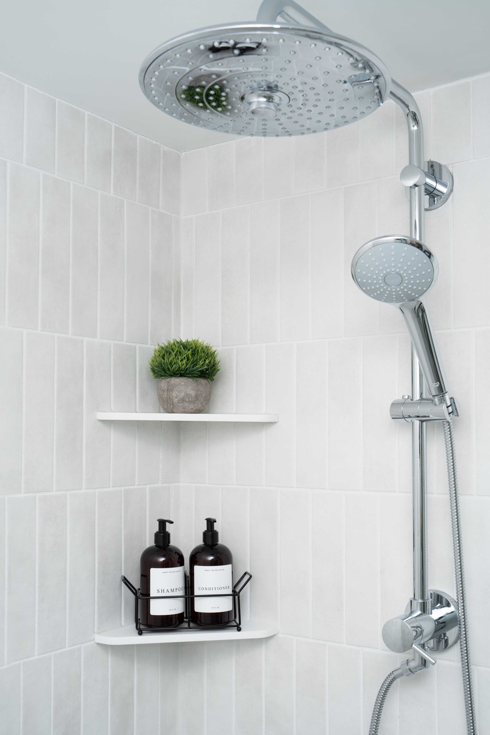 An Orchard Lake remodel featuring a bathroom with a shower head and a shelf.
