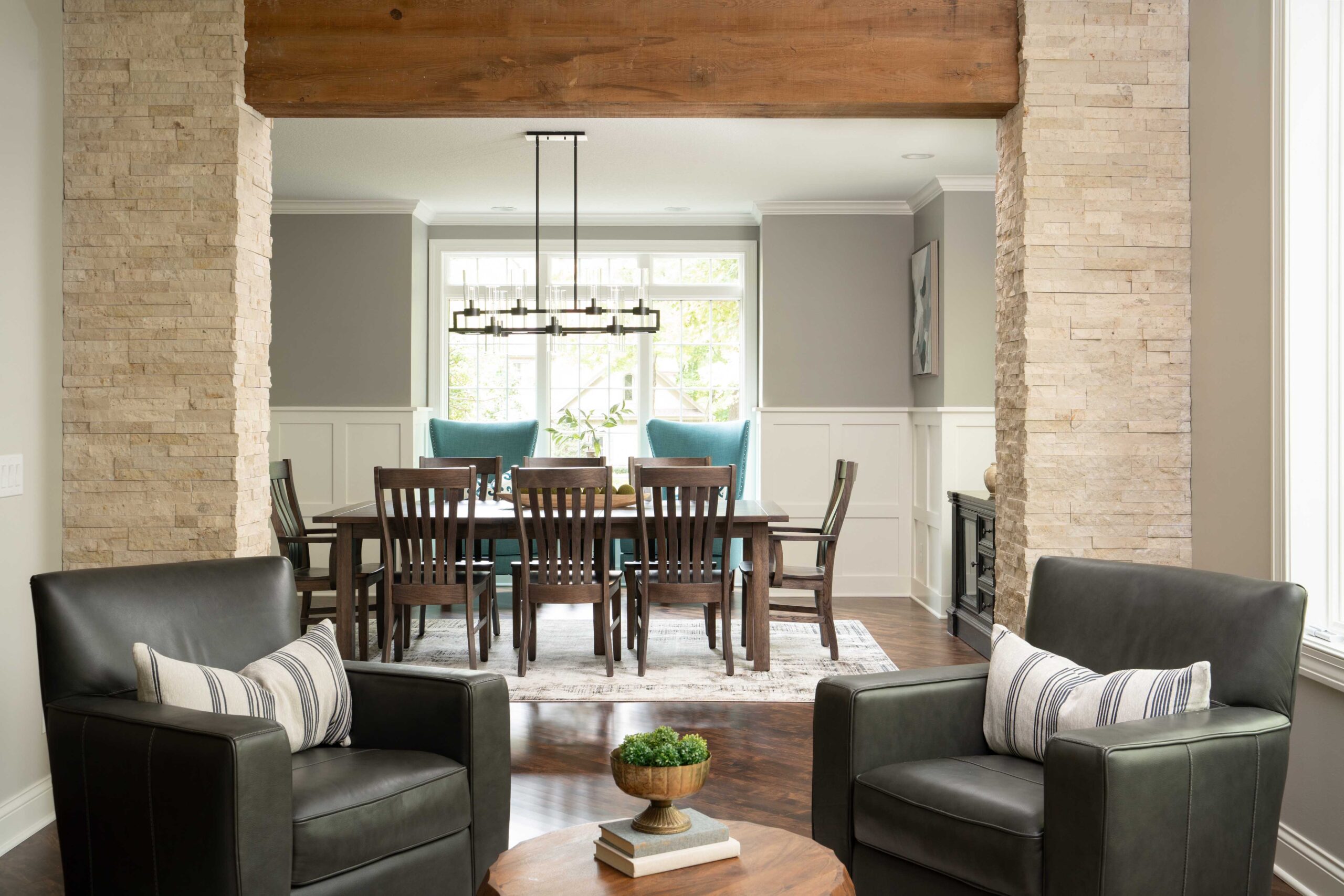 A living room with a dining table and chairs located on Woodside Road in Minnetonka.