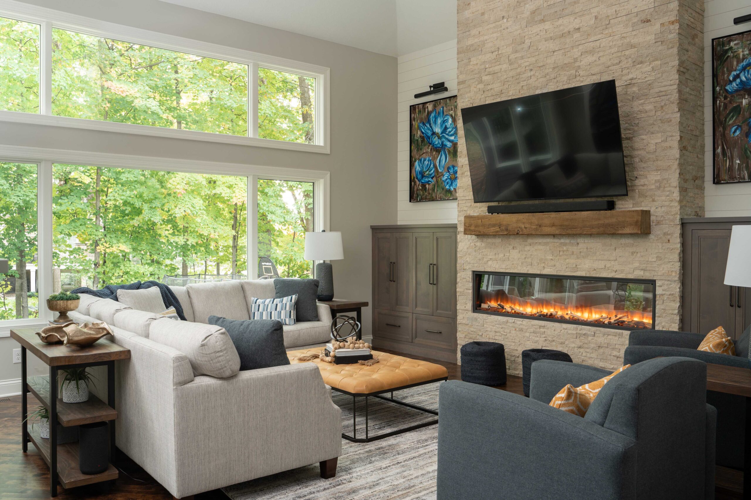 A cozy living room with a fireplace and TV, located on Woodside Road.